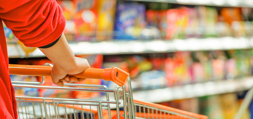 supermarket shelf and woman with trolley